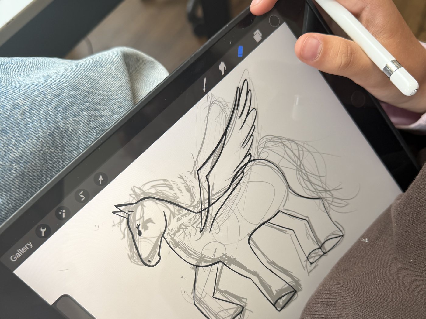 A new design being sketched on a tablet in the workshop